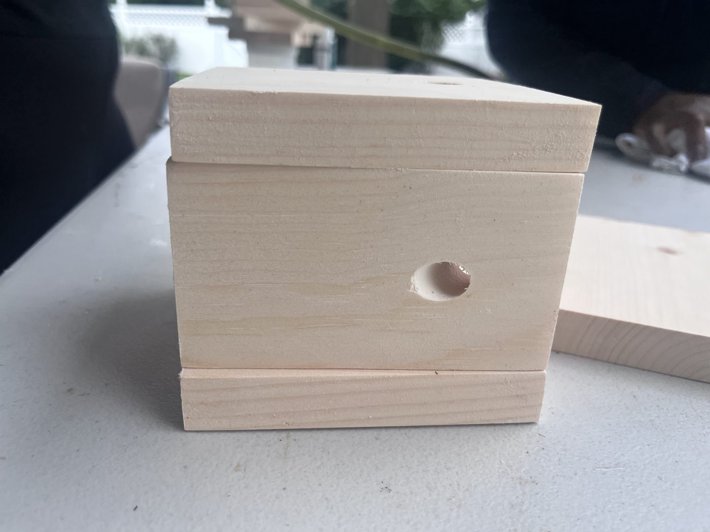 Pine side pieces with their entry holes already drilled through the side.